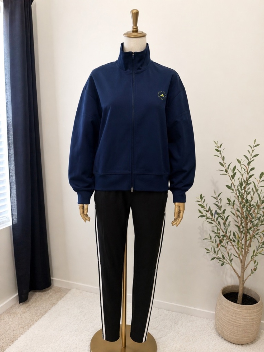 STELLAMcCARTNEY Navy Athletic Zip Jacket with Subtle Stripe Detail.
